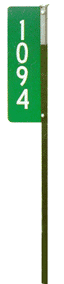 Photograph of a 911 sign on a metal T post.
